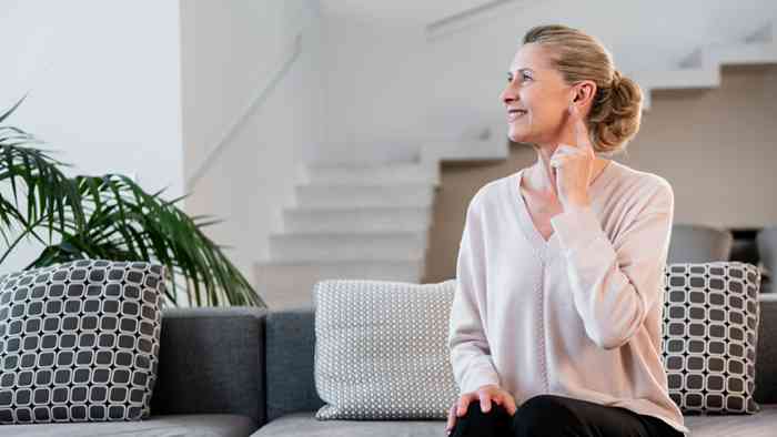 a woman sitting on sofa