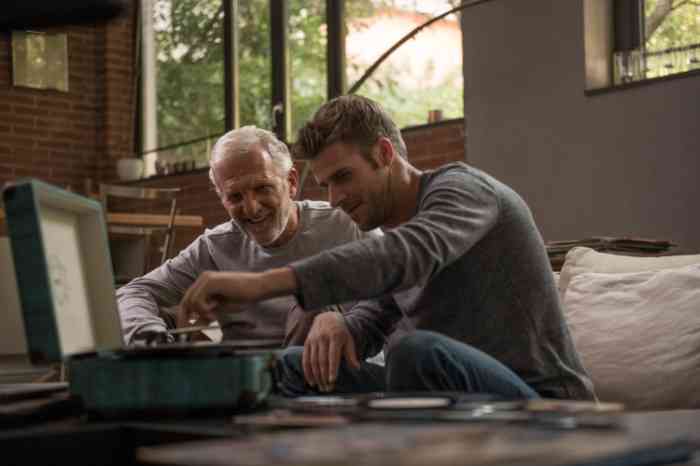 A Granmother listens to her grandson, who's whispering in her ear
