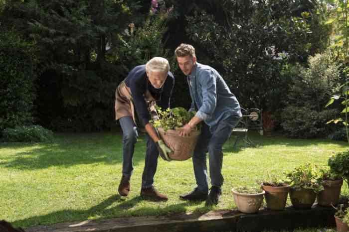 grandpa and nephew gardening with a vase.