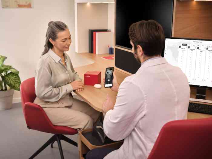a woman with her audiologist