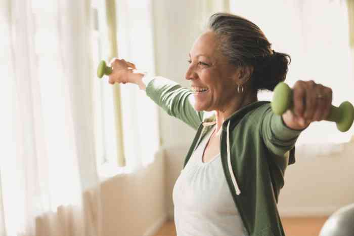 woman exercising with weights at home.