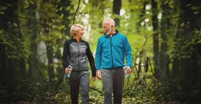 couple walking in the woods.