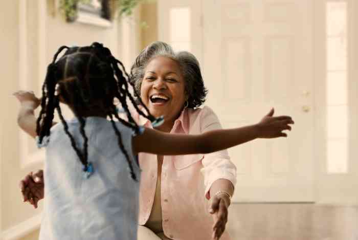A Granddaughter running to hug her Grandma